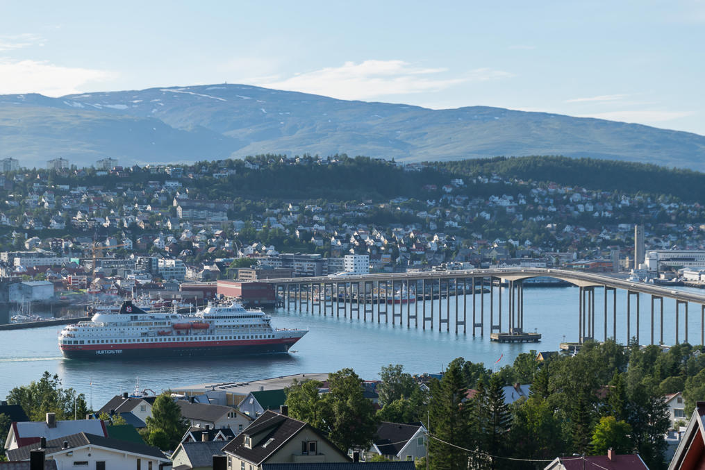 View of Tromsø, Tromsø Bridge, and Hurtigruten ferry from the Storsteinen slope