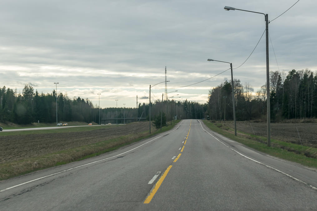 Road 170, the old alignment of National Road 7 (Helsinki-Porvoo-Kotka-Russian border), somewhere near the city of Porvoo, not far from Helsinki. Currently used by local traffic, suburban buses, and bikes. The modern motorway is visible in the left