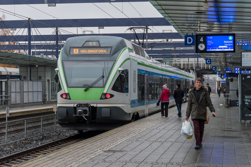 Commuter train in Leppävaara, immediately next to a bus terminal
