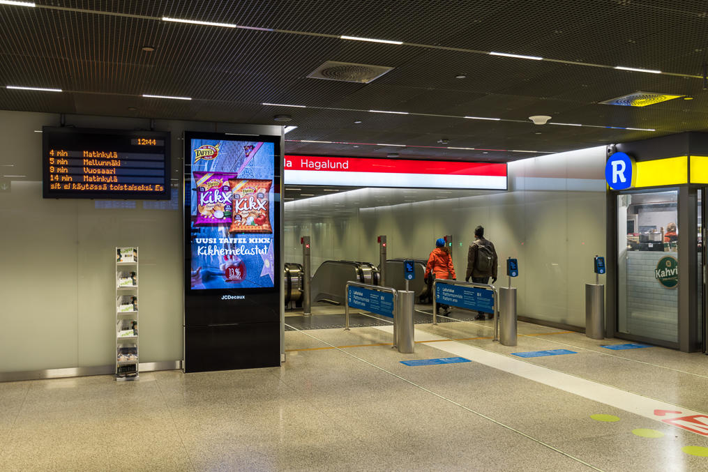 One of the Tapiola metro station escalators.  Note ticket validators without any barries