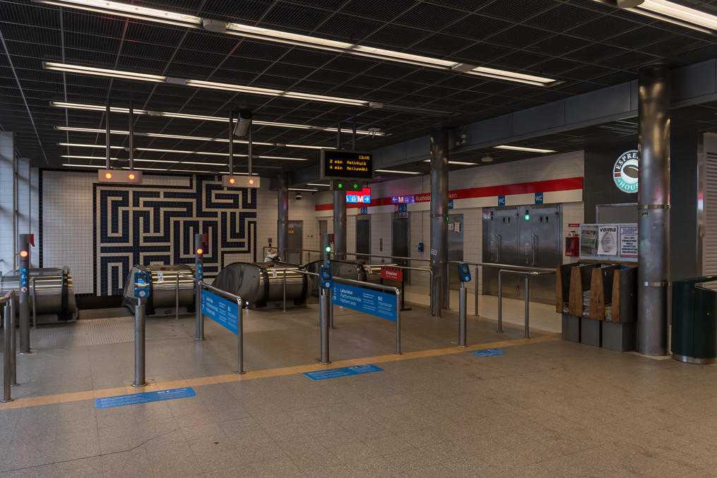 Ruoholahti metro station escalators.  Note ticket validators without any barries
