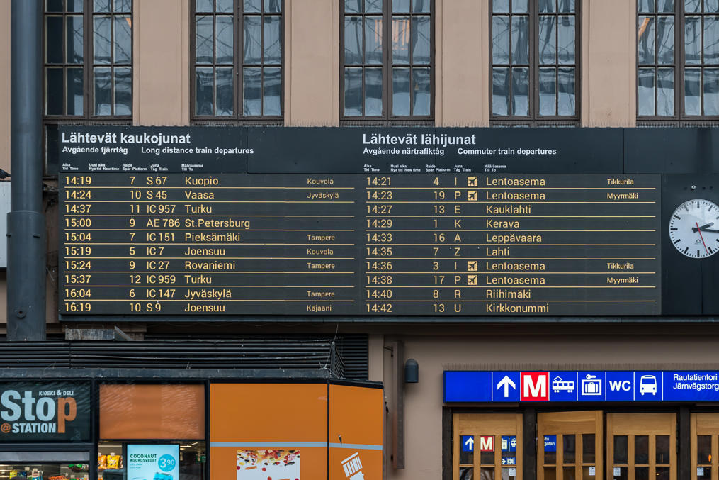 Train display at Helsinki central station.  Long-distance trains to the left, regional and commuter trains to the right