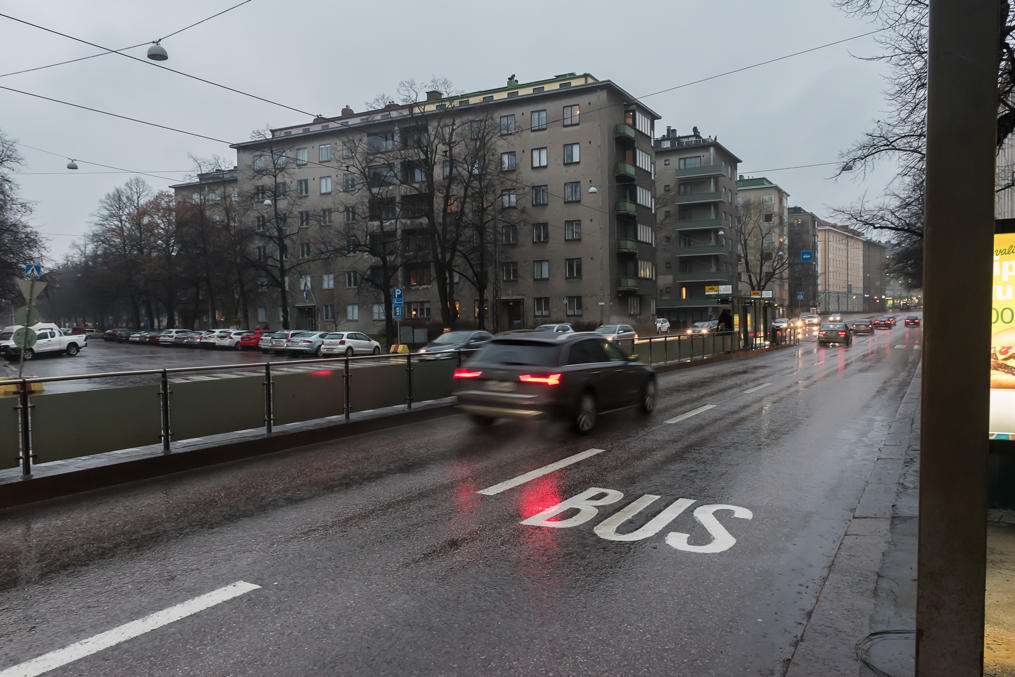 Mannerheinmintie, a major road to the center of Helsinki.  Note bus lane and tram stop/tracks leaving only one car lane