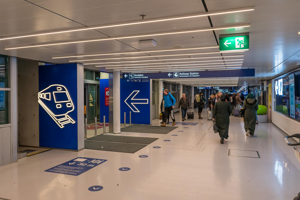 Exit from the airport building to hallways and escalators to the railway station